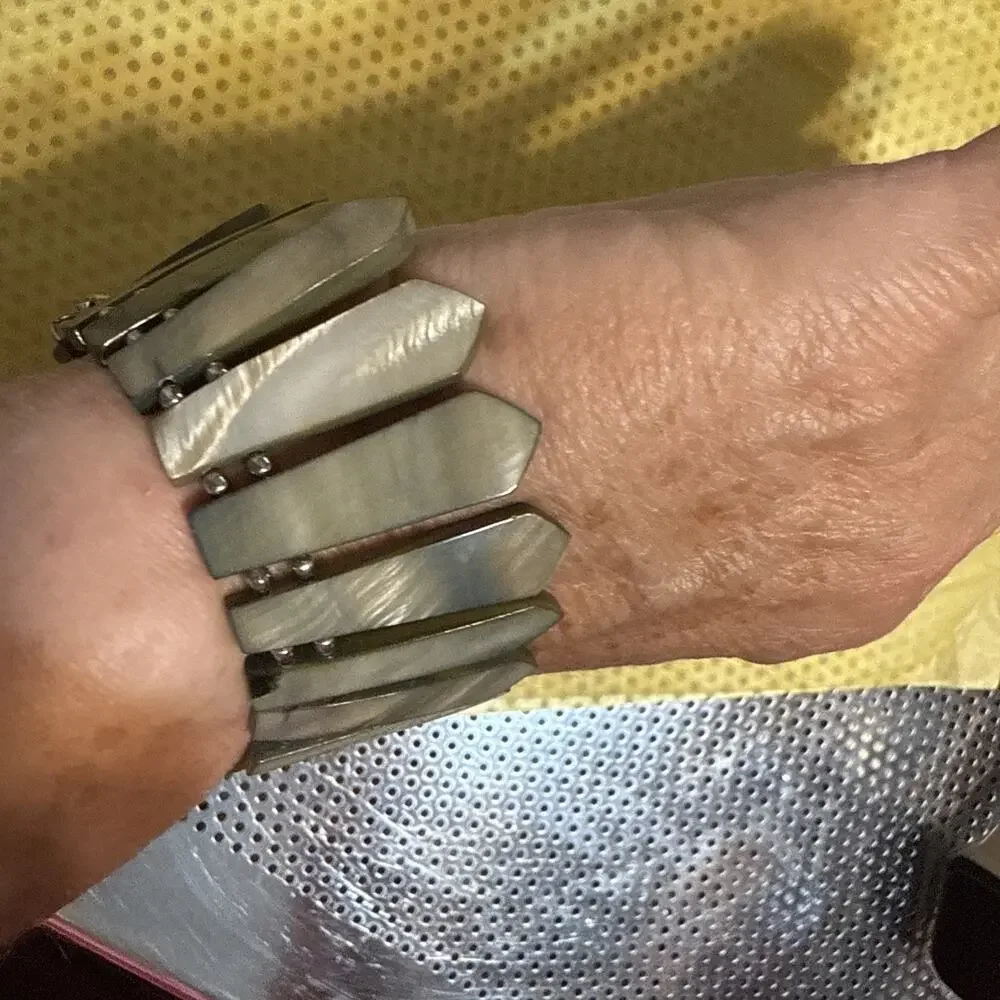 Bracelet made of grey, possibly mother-of-pearl or shell, dagger or leaf-shaped